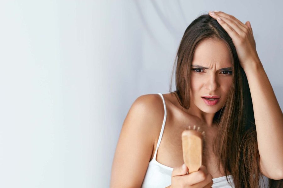 Hair Loss. Upset Woman Holding Brush With Hair | ABC24 Noticias